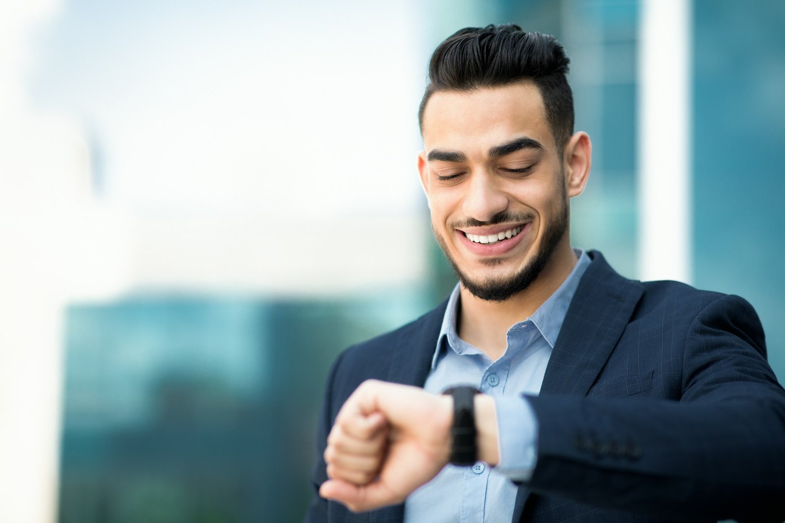 Rich middle-eastern man CEO checking time, having business meeting